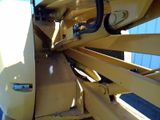 a close up view of a yellow construction vehicle ' s front end