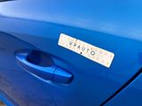 a sticker on the door of a blue car