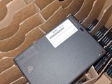 a laptop sitting in a cardboard box on top of a table