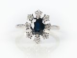 an oval sapphire and diamond cluster ring in white gold