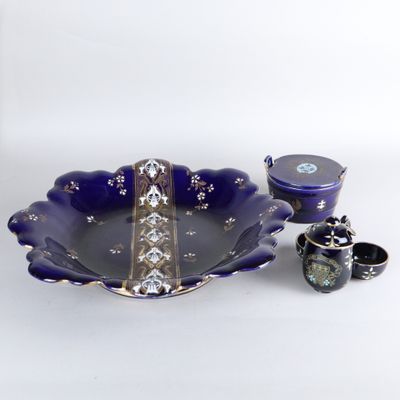 a blue bowl and two cups sitting on a table
