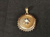a close up of a gold locke with a flower on it
