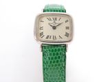 an image of a close up of a wrist watch with roman numerals on it