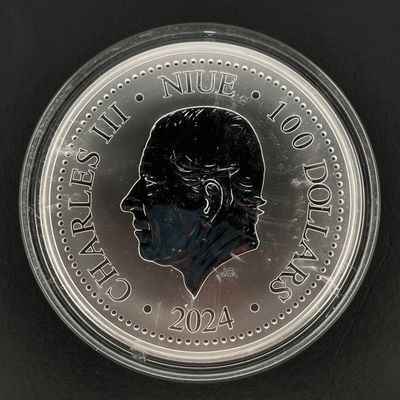 un gros plan d'une pièce de monnaie sur laquelle figure le visage d'un homme