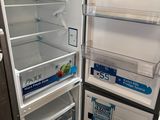 an open refrigerator with its door open on the floor