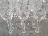 six empty wine glasses sitting on a table