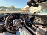 the interior of a car with a person sitting in the driver ' s seat in the driver ' s seat