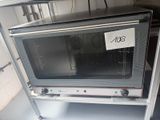 a toaster oven that has a price tag on it