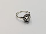 a close up of a ring on a white surface