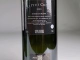 a bottle of wine that is sitting on a table