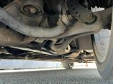 a close up view of a car ' s front suspension