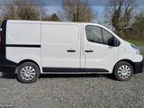 a white van that is parked on the side of the road