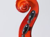 a close up of a violin with a red bow on a white background