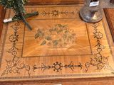 a wooden table with a vase of flowers on it