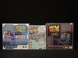 two nintendo wii games sitting on top of a black surface