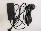 a charger and a power cord on a table