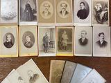 many old photographs of men and women sitting on a table