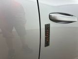 a sticker on the door of a car with a sticker on it