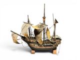 a small model of a pirate ship on a stand