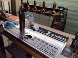 an image of a bar with a bunch of beer taps on it