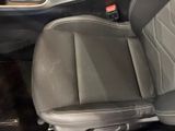 the interior of a car with a black leather seat and black leather trim