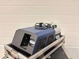 a blue and black machine sitting on top of a case