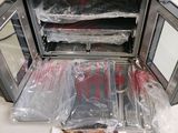 an image of a microwave that has been wrapped in plastic