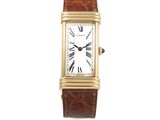 une image d'une montre avec des chiffres romains sur le cadran