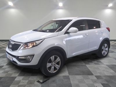 a picture of a white suv that is parked in a garage
