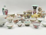 many different types of bowls and vases on the table