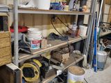 a garage with a lot of tools and supplies on the shelves