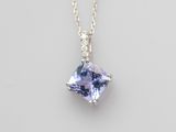 a tanzanite and diamond pendant on a chain