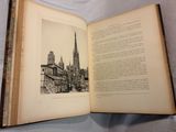 an open book with a picture of a cathedral on it