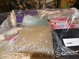 a pile of items wrapped in plastic on a table