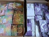 a box full of purple and green items in it