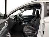 the interior of a car with the door open and the driver ' s seat down