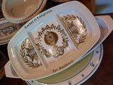 a plate with three different plates on it on a table