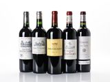 several bottles of wine are lined up on a white surface