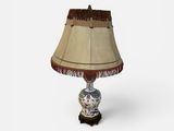 an image of a table lamp with a brown shade on top of it