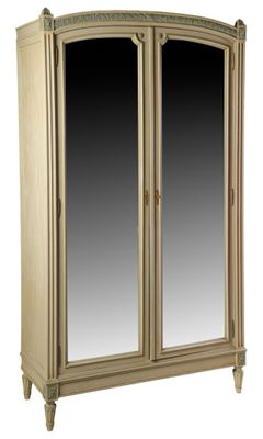 an image of a wooden armoire with two mirrors on top of it