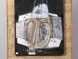 painting on a easel with a painting of a boat on it