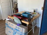 a wooden table with a box on it in the middle of a room