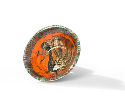 une assiette orange et verte sur laquelle est représenté un coq