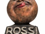 statue of a smiling face on a pedestal with the word rossi written on it