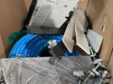 a cardboard box with a bunch of hoses inside of it