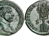 a silver coin with an image of a man and a woman on it
