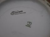 a close up of a plate with a flower on it