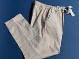 a close up of a pair of pants on a blue surface