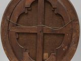 an image of a wooden circular object on a white surface
