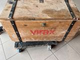 a wooden box on wheels with the word vidx written on it